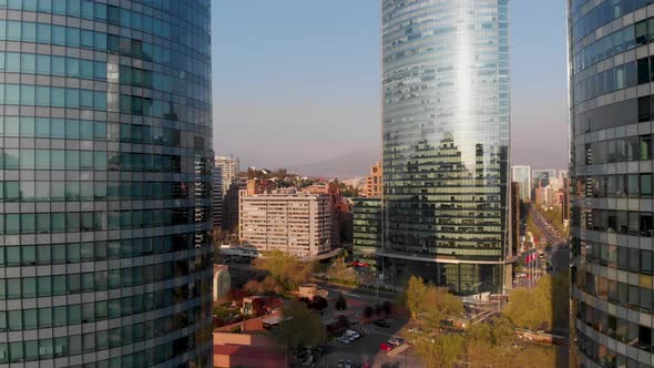 Flying backwards between two buildings revealing the skyline, Santiago, Chile-4K