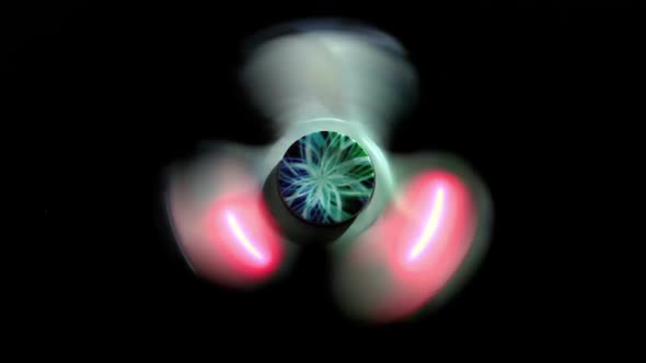 Glowing Spinner Spins On A Black Background 2