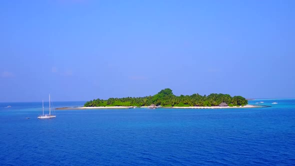 Aerial drone nature of tourist beach trip by blue ocean with sand background