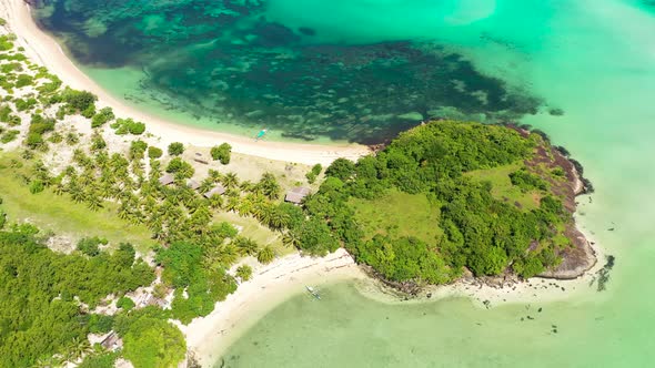 A Lagoon with a Coral Reef and a White Sandy Beach, a View From Above.