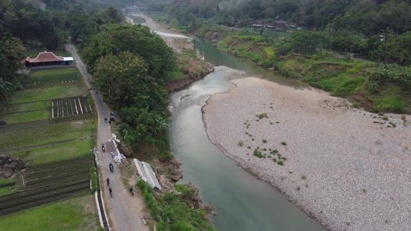 Beautiful aerial view of a less water river in the middle of the mountains in the morning