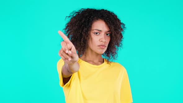 Portrait of Serious Mixed Race Woman Showing Rejecting Gesture By Stop Finger Sign