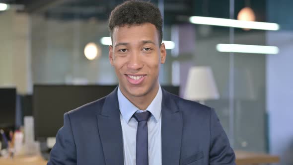 Portrait of Smiling Young Businessman Looking at the Camera 