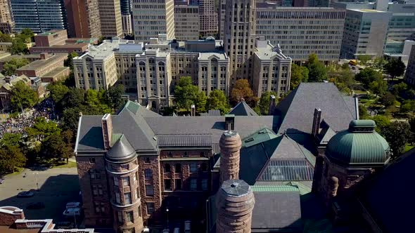 View of Ontario Legislature and downtown Toronto buildings, aerial drone slide. Roof tiles and coppe