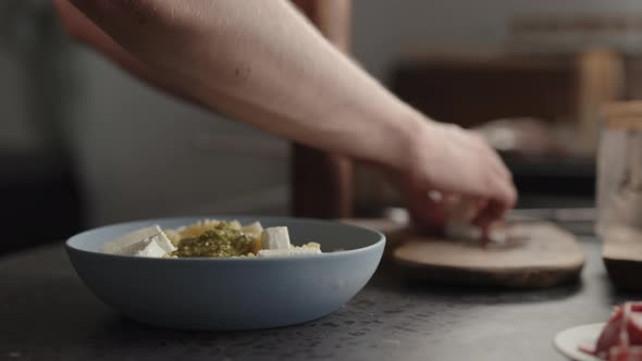 Slow Motion Add Mozzarella to Fusilli Pasta in Blue Bowl