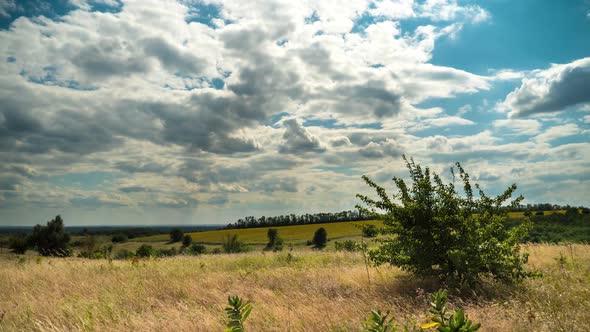 Moving Clouds in Blue Sky Above Landscape Fields. Timelapse. Amazing Rural Valley. Ukraine