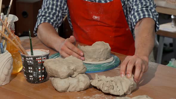 Male Potter Making Ceramic Bowl at His Workshop