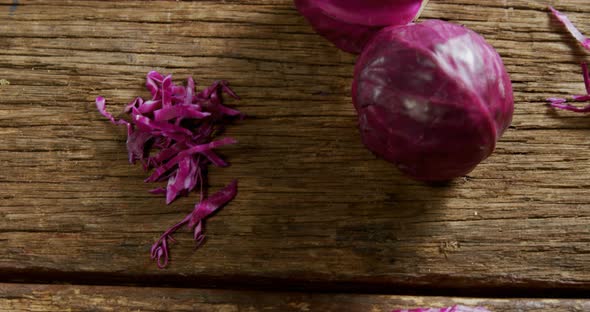 Red cabbage on wooden table 4k