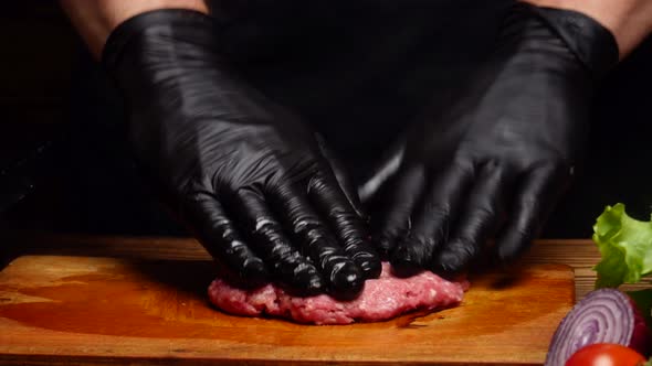 Chef Mixing Ground Beef and Shaping a Burger Patty