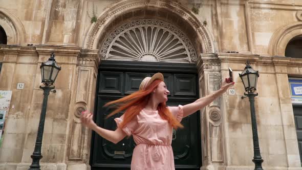 Happy Woman Tourist Takes Selfie on Streets of Old City Italy Puglia