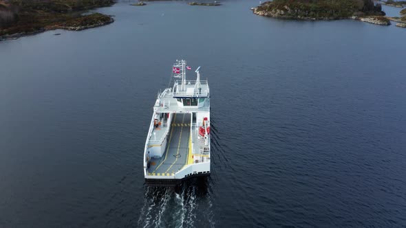 Flying over electric car ferry at sea - Birdseye aerial Norway