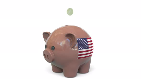 Putting Money Into Piggy Bank with Flag of the United States