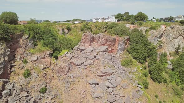 Descending over the cliffs of Torquay. Rocks and stones on cliffs at the beach. Landslip at the shor