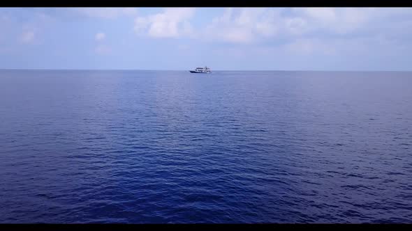 Aerial above nature of perfect coast beach trip by blue sea with white sand background of a dayout n