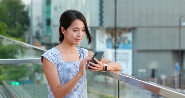 Woman Use of Mobile Phone at Outdoor