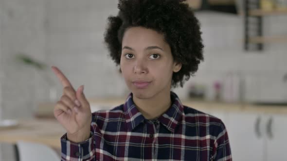 Portrait of African American Woman Saying No with Finger Sign