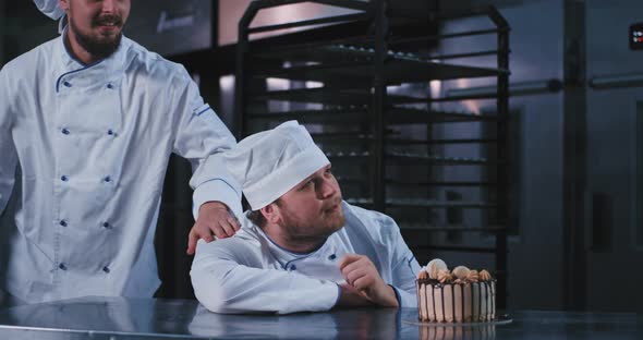 Two Ecstatic Handsome Looking Baker Men with