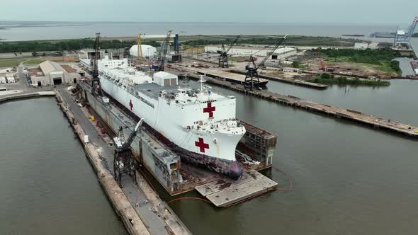 Aerial Point of view of a medical ship being repaired dry dock in Mobile, Alabama