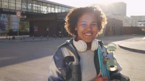 Skater Girl Posing in Sunlight