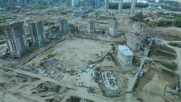 Construction site of a modern city block. High-rise buildings under construction.