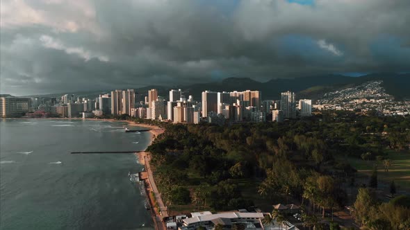 Aerial drone footage of Honolulu, Hawaii. Beautiful real estate, buildings in the city. Palm trees