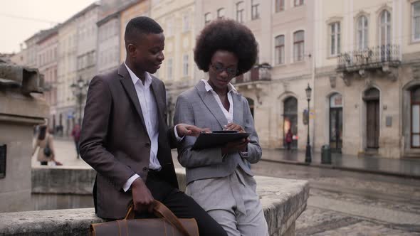 Afro American People Discussing Working Moments on Street