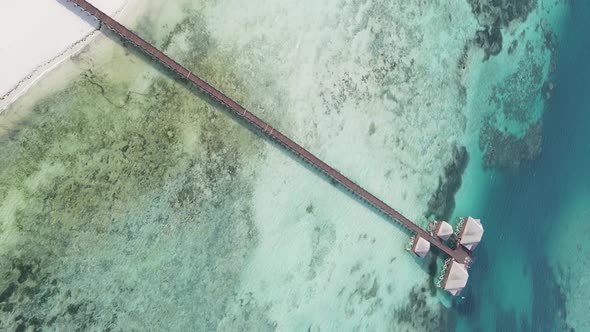 Vertical Video House on Stilts in the Ocean on the Coast of Zanzibar Tanzania Aerial View