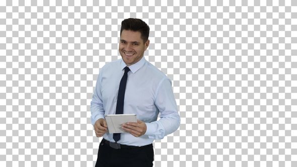 Happy businessman walking in using tablet turning on something