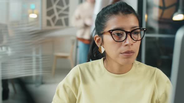 Time Lapse of Hispanic Businesswoman Working on Computer