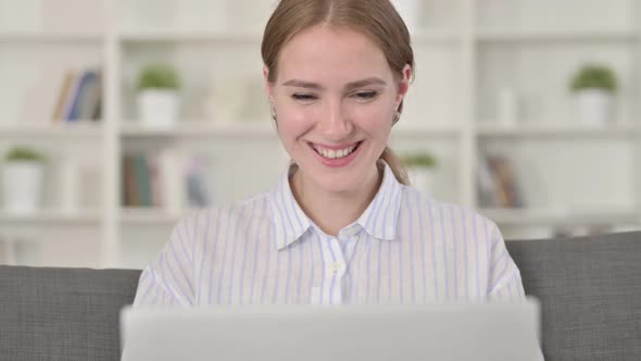 Portrait of Young Woman Doing Video Call on Laptop