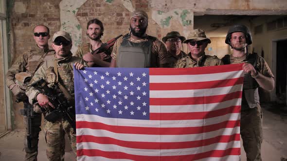 Squad of Diverse Military Men Holding USA Flag