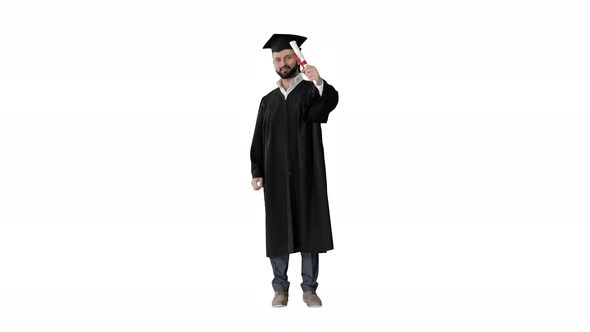 Happy Student Wearing the Graduation Robe and Holding His Certificate and Raising His Thumb Up on