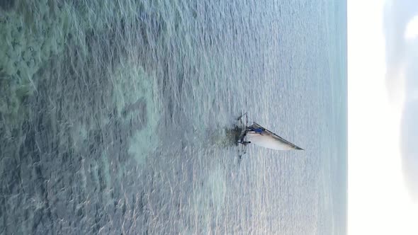 Tanzania Vertical Video  Boat Boats in the Ocean Near the Coast of Zanzibar Aerial View