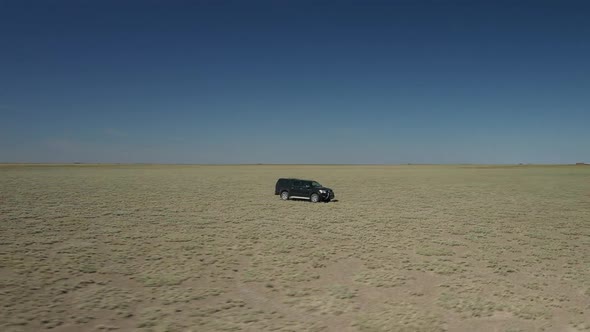 Black Pickup In Middle Of Plains 