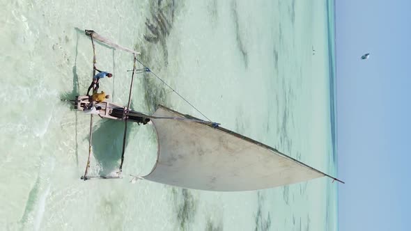 Vertical Video Boats in the Ocean Near the Coast of Zanzibar Tanzania Aerial View