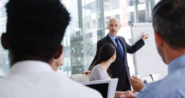 Business people applauding during a meeting