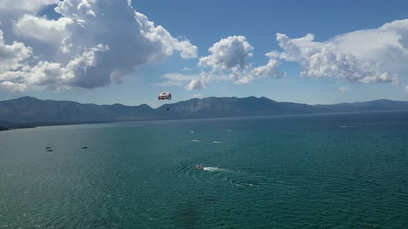 Paragliding Over The Beautiful Lake Tahoe In California - aerial drone shot