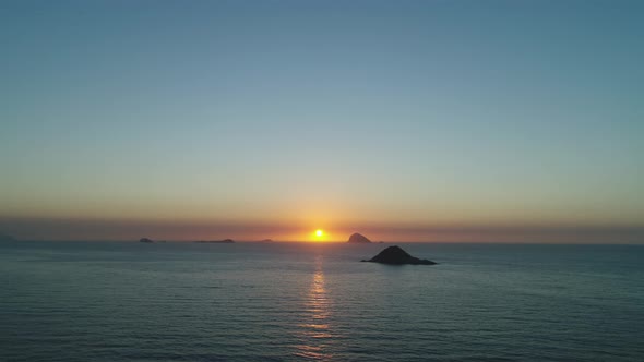 sunrise in Rio de Janeiro, with Favela da Rocinha in the background.