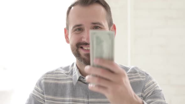 Adult Young Man Giving Dollar Paper Currency