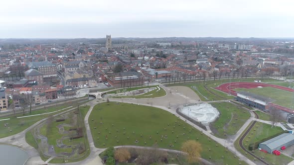 Aerial Shot Tongeren City and De Motten Recreation Park on Cloudy Day