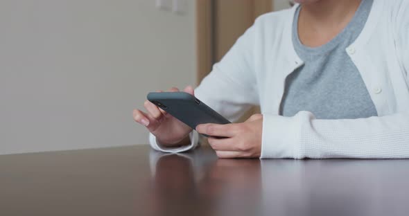 Woman use of smart phone at home