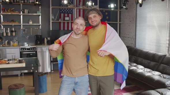 Homosexual Couple with Rainbow Flag