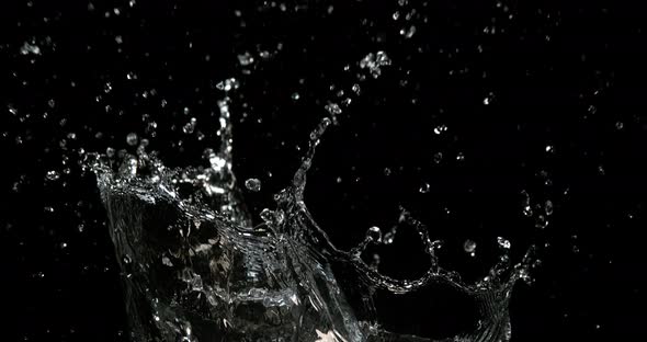 Water Exploding and Splashing against Black Background, Slow motion 4K