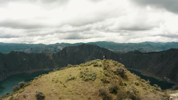 Aerial View Of The Quilotoa Lake In The Crater Of The Volcano In Ecuador - drone shot