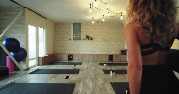 Modern Yoga Studio Lady Coming in To Start Her