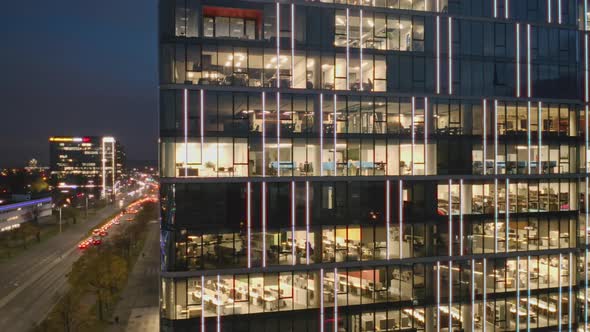 Aerial View of the Night Windows of Offices in a Modern Skyscraper