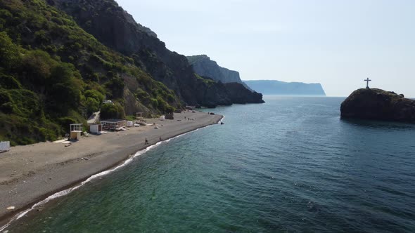 Aerial View From Above on Calm Azure Sea and Volcanic Rocky Shores