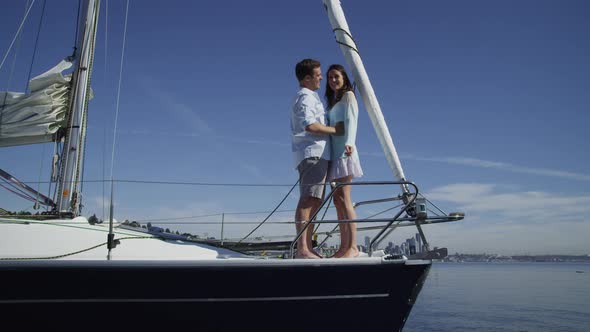 Young couple on sailboat together. Shot on RED EPIC for high quality 4K, UHD, Ultra HD resolution.