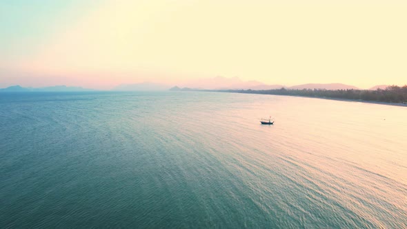 4K Aerial view of drone move on beautiful sea. sunset over ocean waves sand beach.