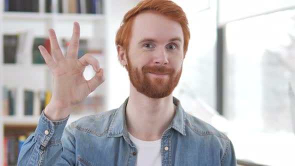 Casual Redhead Man Showing Sign of Okay